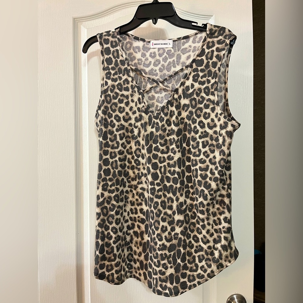 Leopard sleeveless top with cross detailed neck line